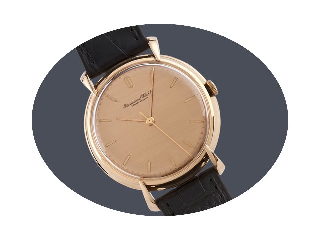 IWC Gents18ct gold manual on strap...