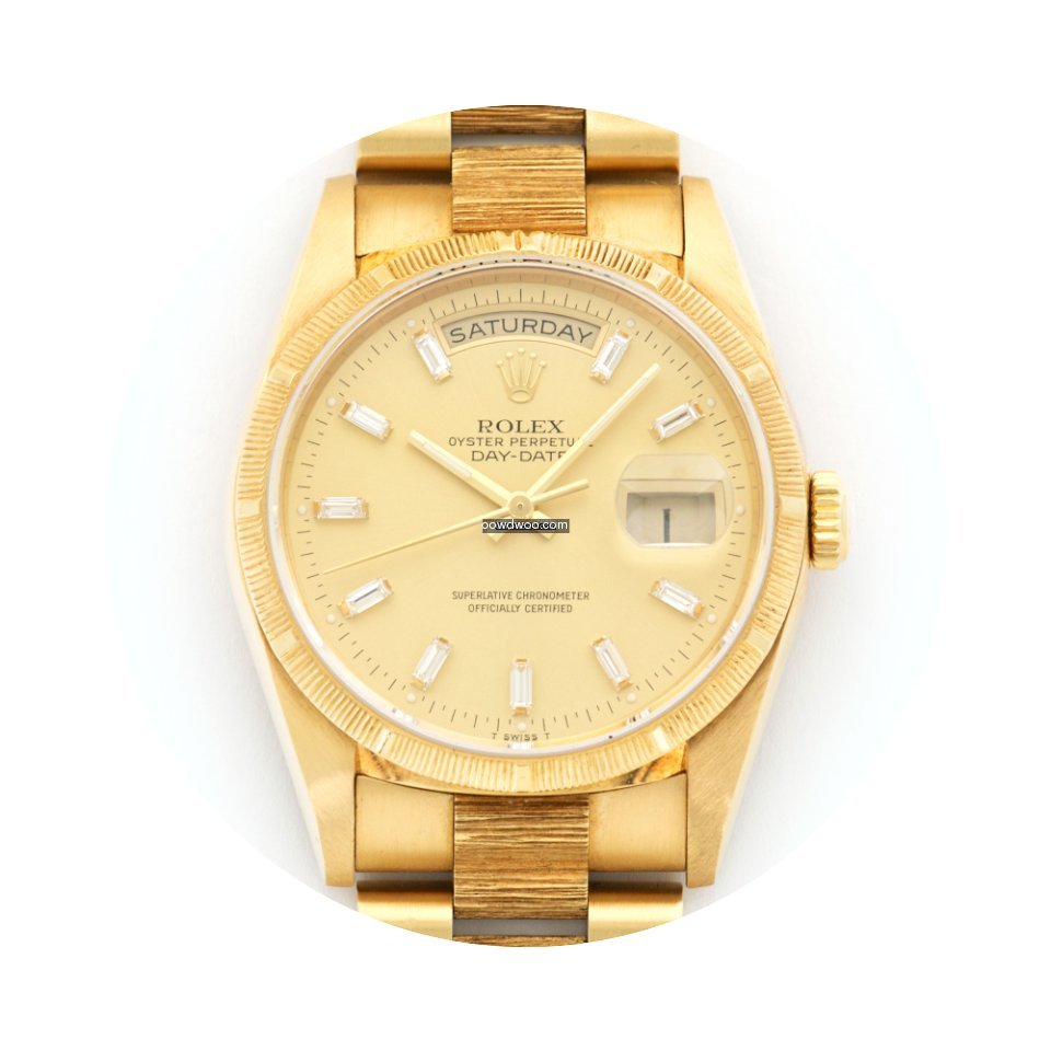 Rolex Day-Date Yellow Gold Bark Baguette...
