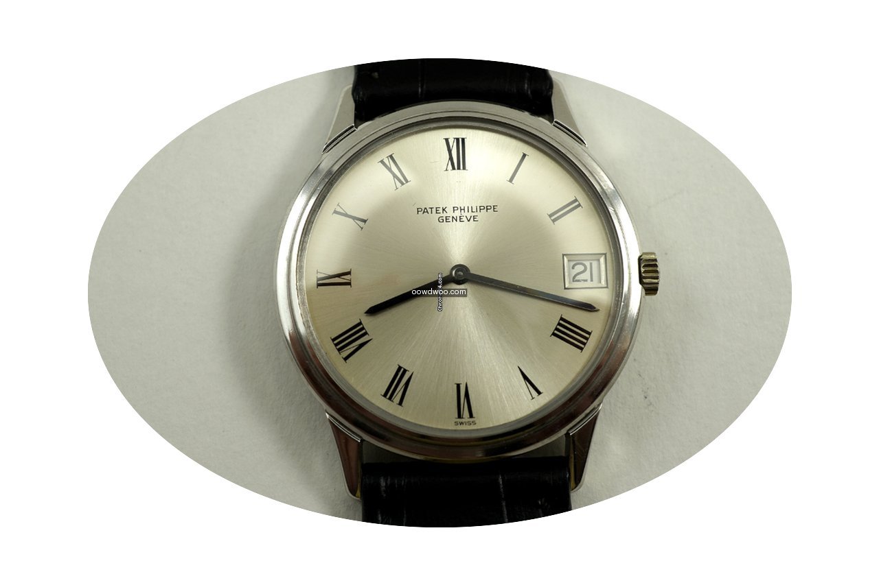 Patek Philippe 18K automatic date with e...